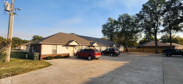 18 Brookland St, Brookland, AR 72417 - view of front of property featuring a front yard, brick siding, and uncovered parking
