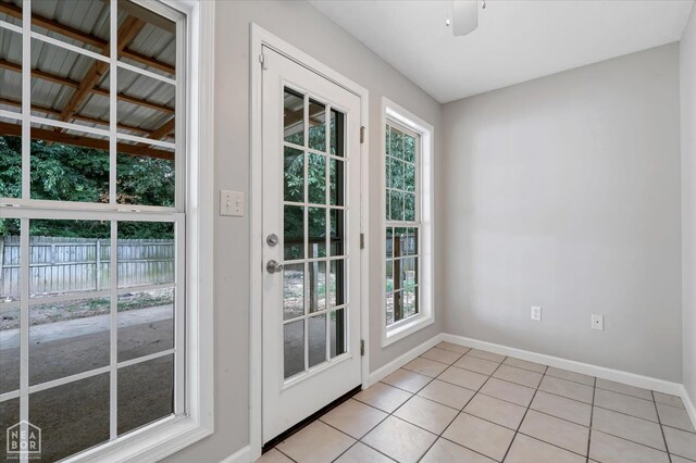 1104 Sandino Dr, Jonesboro, AR 72405 - doorway to outside with light tile patterned flooring and plenty of natural light