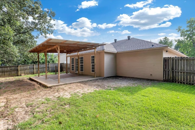 1104 Sandino Dr, Jonesboro, AR 72405 - back of house with a patio, a fenced backyard, and a shingled roof