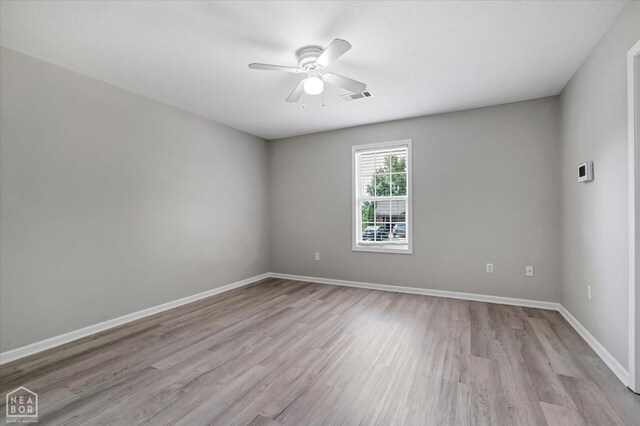 1104 Sandino Dr, Jonesboro, AR 72405 - empty room with light wood-type flooring and ceiling fan