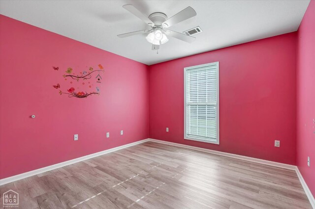 1104 Sandino Dr, Jonesboro, AR 72405 - spare room featuring ceiling fan and wood finished floors