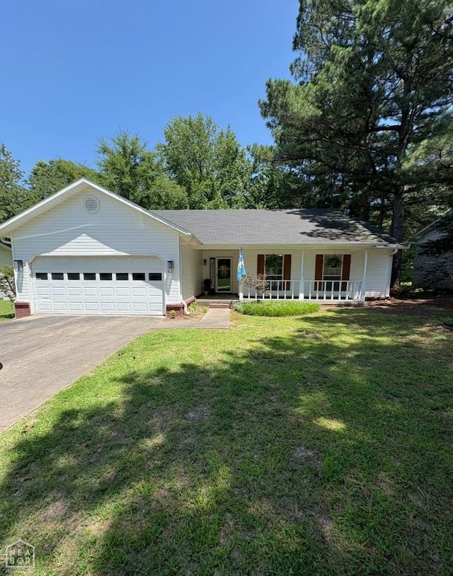 303 N Center Hill Rd N, Paragould, AR 72450 - single story home with covered porch, a garage, concrete driveway, and a front yard