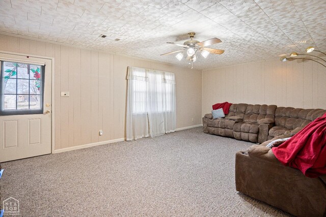 1303 Magnolia Ave, Walnut Ridge, AR 72476 - carpeted living room with baseboards, a ceiling fan, and visible vents