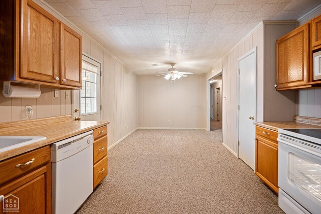 1303 Magnolia Ave, Walnut Ridge, AR 72476 - kitchen with brown cabinets, white appliances, ceiling fan, light carpet, and ornamental molding