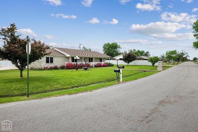 1303 Magnolia Ave, Walnut Ridge, AR 72476 - view of front of property featuring a front lawn and fence