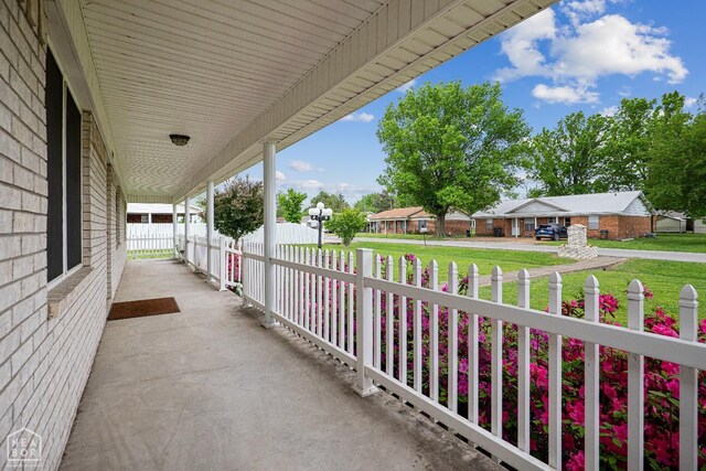 1303 Magnolia Ave, Walnut Ridge, AR 72476 - view of patio with a residential view and fence