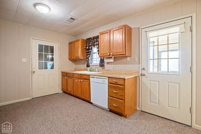 1303 Magnolia Ave, Walnut Ridge, AR 72476 - kitchen featuring light countertops, dishwasher, visible vents, a sink, and light colored carpet