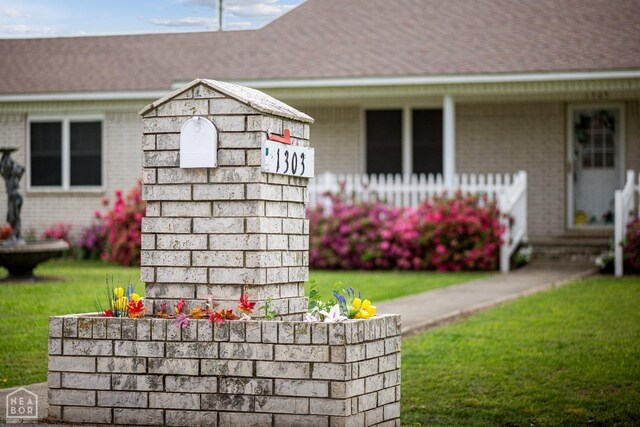 1303 Magnolia Ave, Walnut Ridge, AR 72476 - details featuring brick siding and a shingled roof