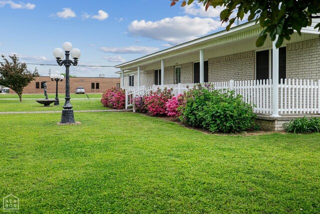 1303 Magnolia Ave, Walnut Ridge, AR 72476 - view of yard featuring covered porch