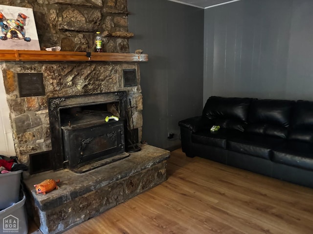 48 E Lakeshore Dr, Williford, AR 72482 - living area with wood finished floors, a fireplace, and ornamental molding