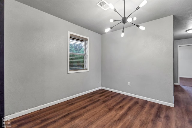 2504 SE 2nd St SE, Hoxie, AR 72433 - unfurnished room with wood finished floors, a chandelier, and baseboards