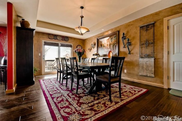 69 Jackson Rdg, Eureka Springs, AR 72631 - dining room with a tray ceiling and dark hardwood / wood-style floors