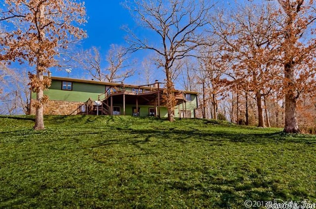 69 Jackson Rdg, Eureka Springs, AR 72631 - back of property featuring a wooden deck and a yard