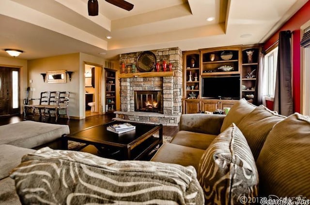 69 Jackson Rdg, Eureka Springs, AR 72631 - living room with a raised ceiling, ceiling fan, a fireplace, and wood-type flooring