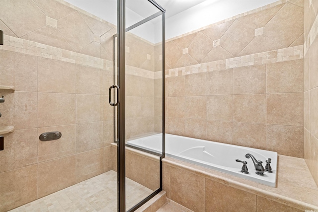 bathroom with separate shower and tub and tile flooring