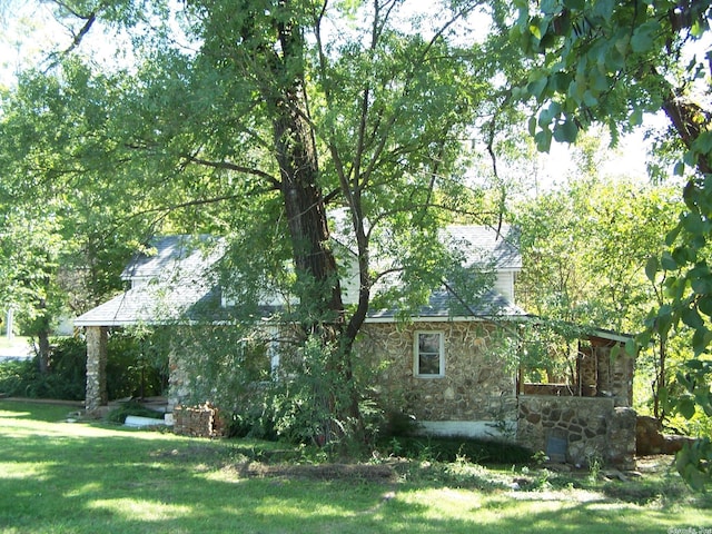 rear view of house with a lawn