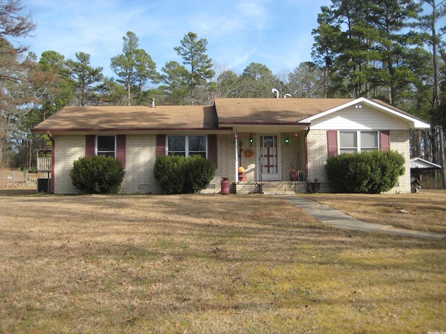 ranch-style home with a front lawn