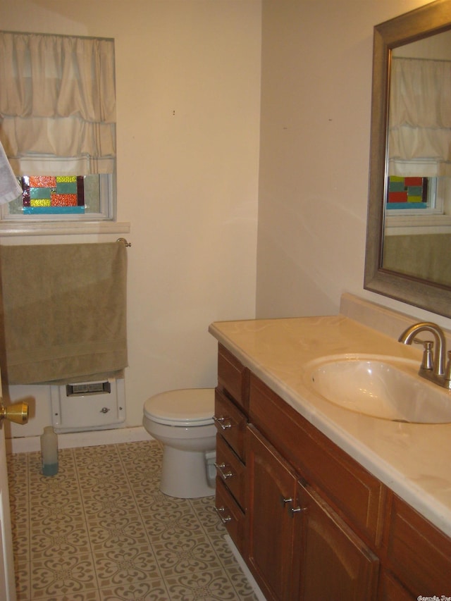 bathroom featuring vanity, toilet, and tile patterned floors