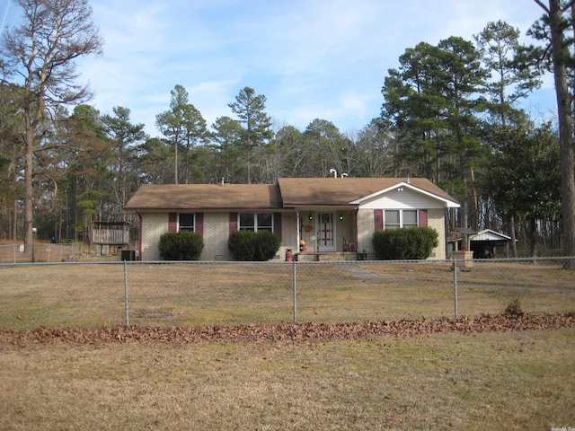 ranch-style home featuring a front lawn