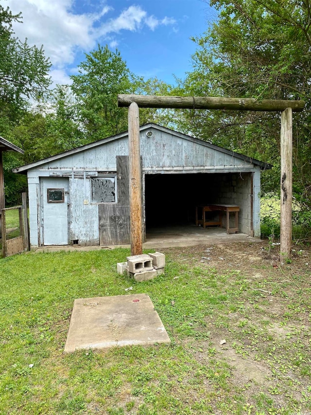 view of outbuilding featuring a yard