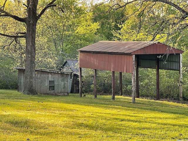 view of outdoor structure featuring a lawn