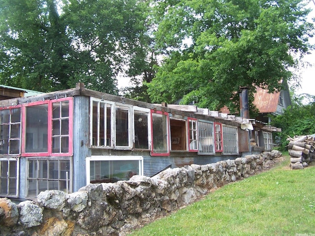 exterior space with a lawn