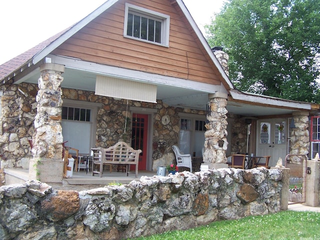 back of house with covered porch