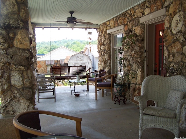 view of patio featuring ceiling fan