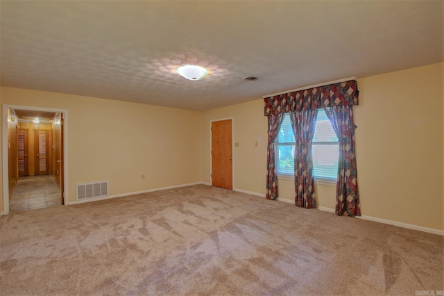 empty room featuring light colored carpet