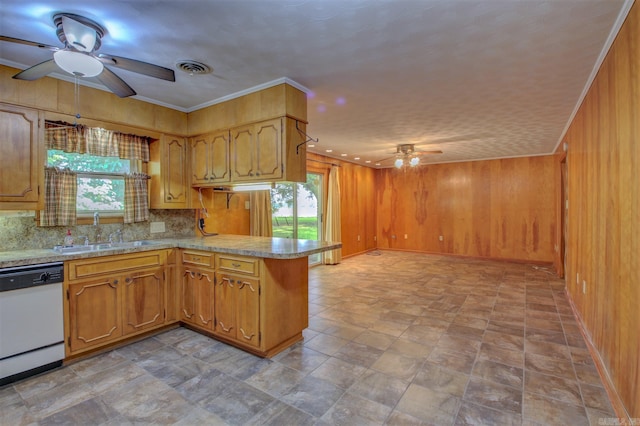 kitchen featuring white dishwasher, kitchen peninsula, ceiling fan, and sink