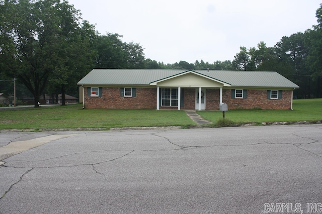 ranch-style house with a front lawn