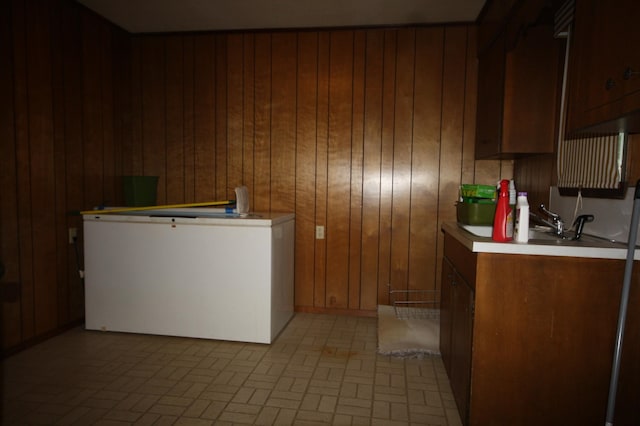 washroom with wooden walls