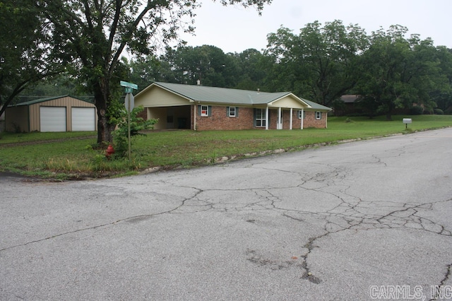 single story home with a front lawn and a garage