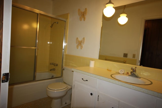 full bathroom featuring toilet, vanity, enclosed tub / shower combo, tile flooring, and an inviting chandelier