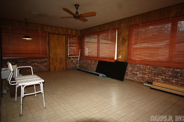 interior space featuring ceiling fan