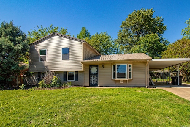 split level home with a front yard and a carport