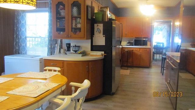 kitchen with stainless steel appliances and light wood-type flooring