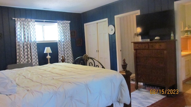 bedroom with hardwood / wood-style flooring and a closet