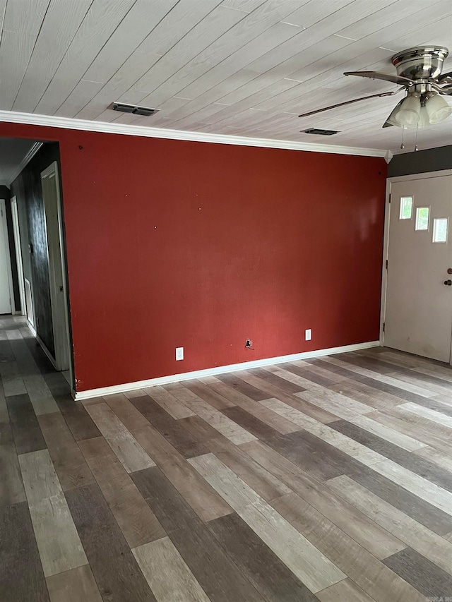 empty room with ceiling fan, ornamental molding, and dark hardwood / wood-style floors