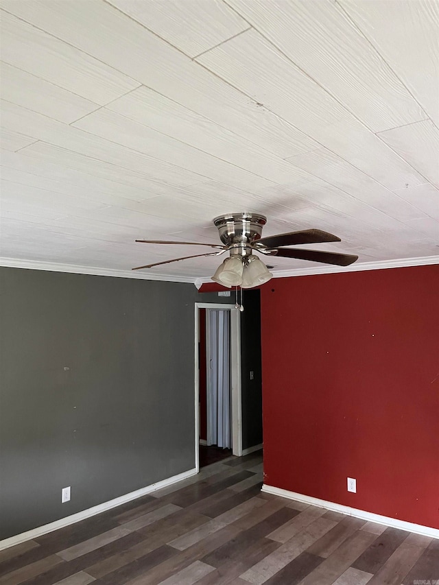 empty room with crown molding, ceiling fan, and dark hardwood / wood-style flooring