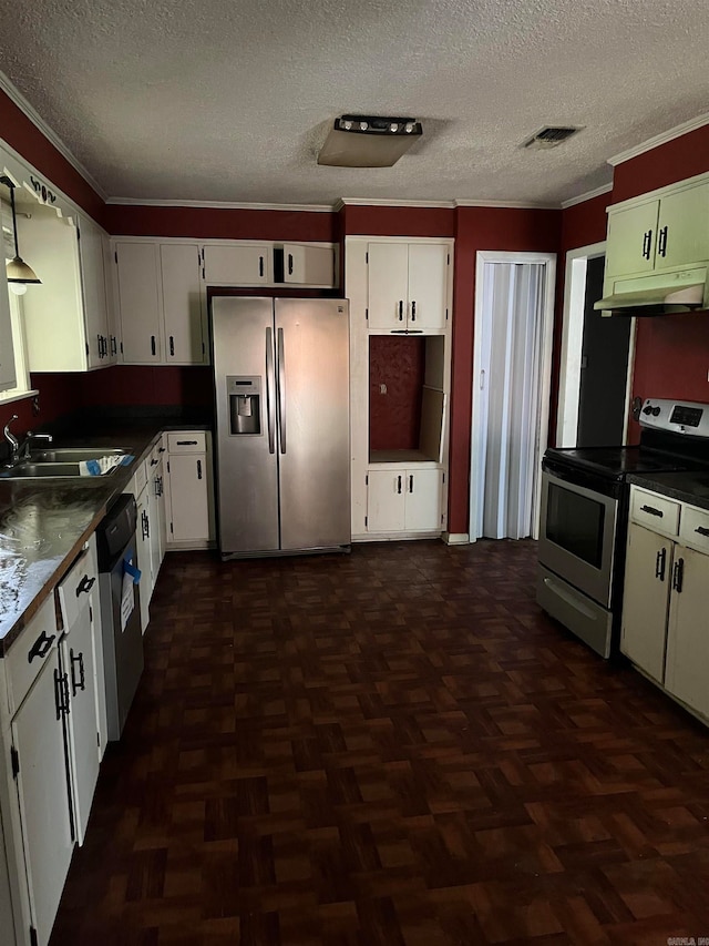 kitchen featuring dark parquet flooring, white cabinetry, appliances with stainless steel finishes, and sink