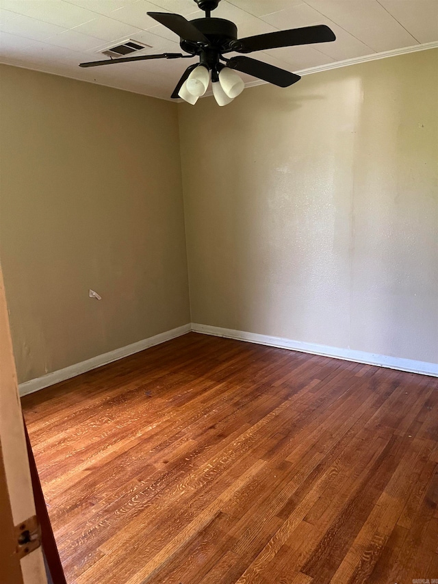 unfurnished room with ceiling fan and hardwood / wood-style flooring