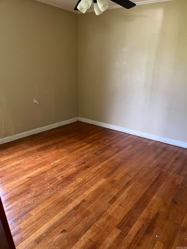 unfurnished room featuring ceiling fan and wood-type flooring