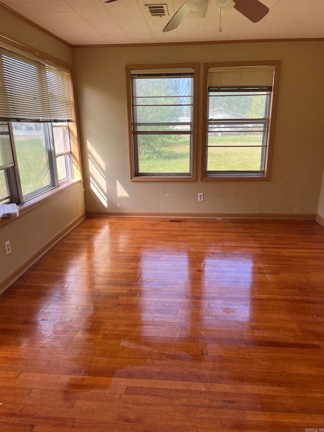 empty room featuring ceiling fan and light hardwood / wood-style flooring