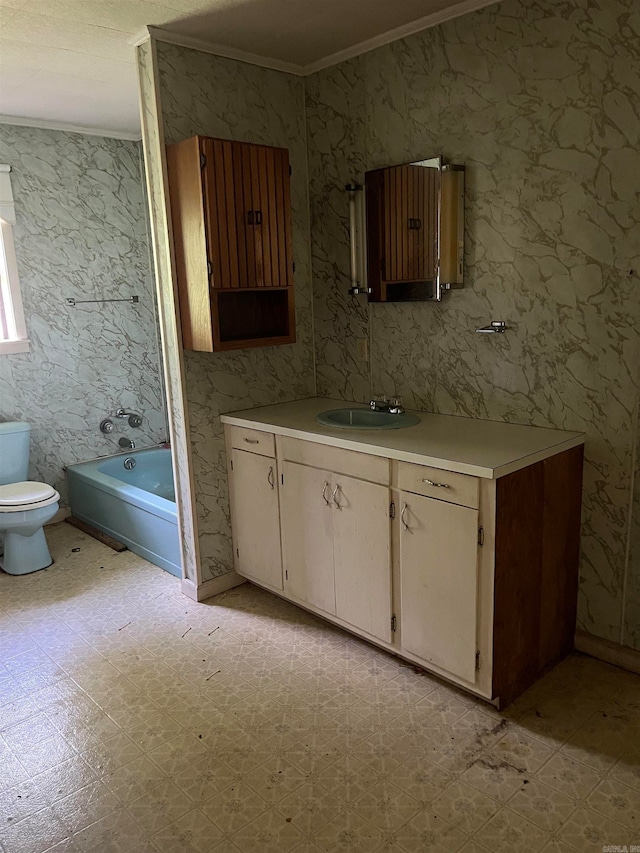 full bathroom featuring ornamental molding, toilet, vanity, and tile floors