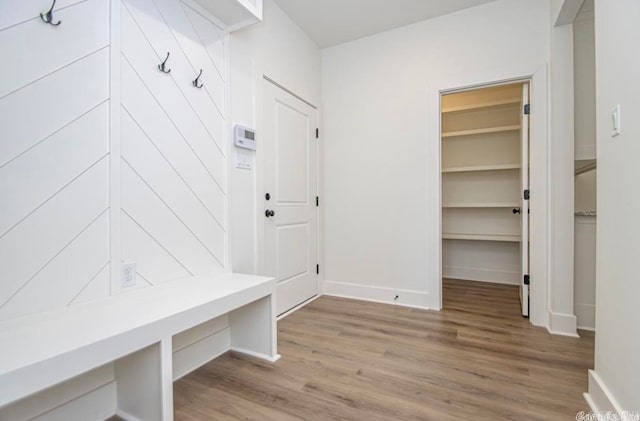 mudroom with light hardwood / wood-style flooring