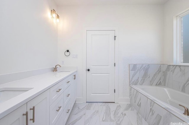 bathroom with tile flooring, tiled tub, and dual bowl vanity