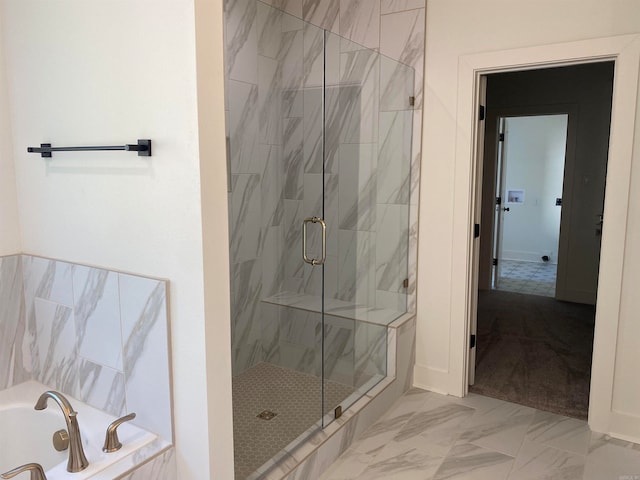 bathroom featuring shower with separate bathtub and tile floors