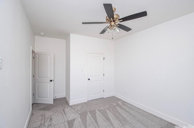 empty room with light carpet and ceiling fan