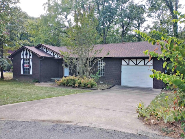 view of front facade with a front yard and a garage